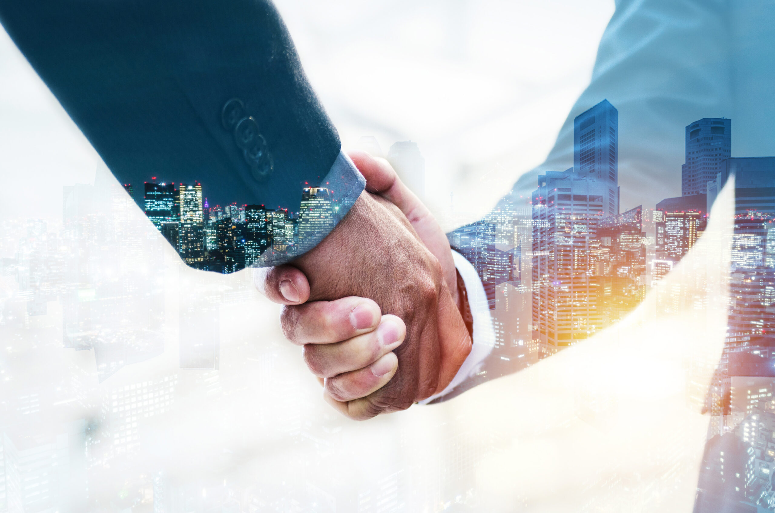 welcome-double-exposure-business-man-partner-handshake Welcome. double exposure of business man partner handshake with during sunrise and cityscape background, digital communication technology, investment, negotiation, partnership and teamwork concept